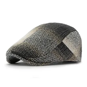 Vintage herringbone wool flat cap with classic British patchwork pattern in neutral tones