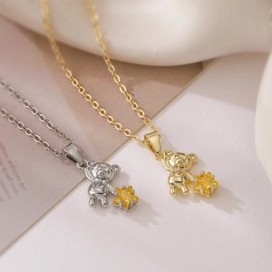 Gold and silver bear necklaces with yellow star zircon charms on minimalist O-chains