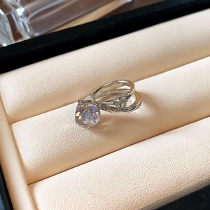 Macro detail of silver ring with double band design and sparkling round crystal stone