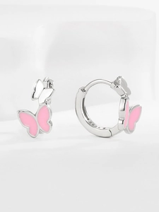 Macro detail of S925 sterling silver butterfly earrings with pink enamel and metal hallmark