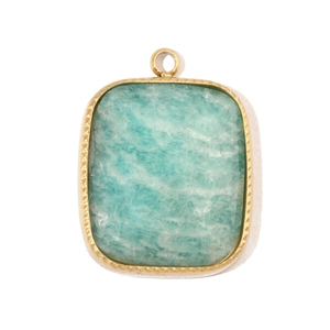 Detailed macro view of gold-plated stainless steel star pendant with natural turquoise stone