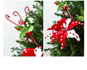 Detail of Christmas tree candy cane picks and festive red white floral ornaments