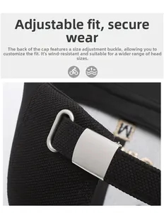 Detail of black baseball cap showing adjustable silver buckle and breathable fabric texture