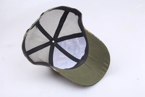 Detail view of the breathable mesh structure and interior stitching of camouflage trucker hat