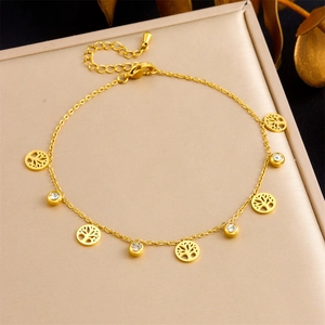 Detail of gold tree of life anklet with rhinestones on a premium display box