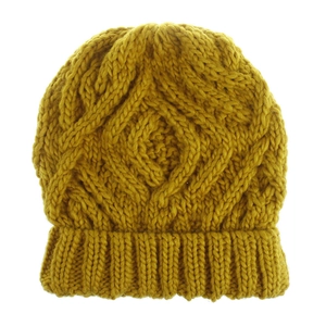 Close-up of mustard yellow thick knit beanie featuring classic diamond cable patterns