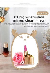 Detail of deer-shaped wooden vanity mirror with antlers and high-definition reflection