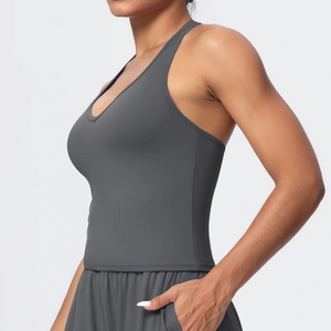 Detail view of charcoal grey yoga shorts with side pocket and high-stretch fabric texture