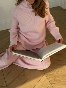 Pink rib-knit sweater set detail showing warm natural lighting on cozy loungewear