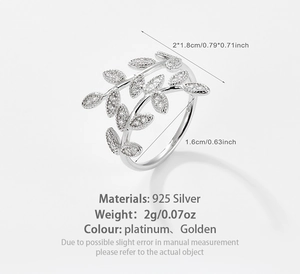 Detailed close-up of 925 sterling silver leaf ring with fine zircon inlay and engravings