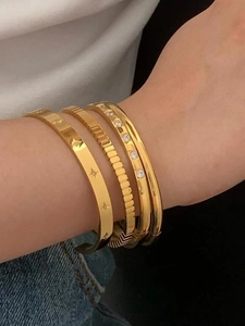 Three-piece gold titanium steel bracelets set with star engraving and zircon accents
