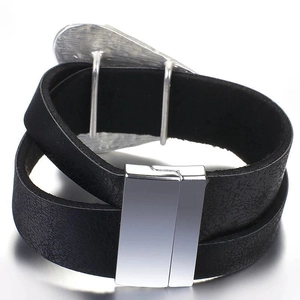 Macro detail of black leather double-wrap bracelet with polished silver magnetic clasp