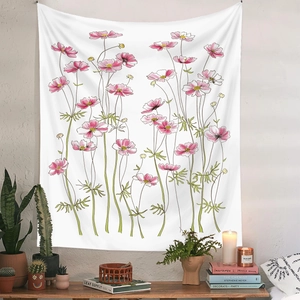 Detail of floral tapestry featuring pink cosmos flowers hanging above a wooden console table