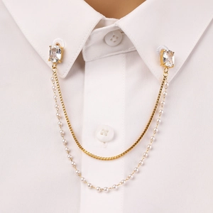 Golden double-layer pearl chain collar clip with square zircon on a white shirt