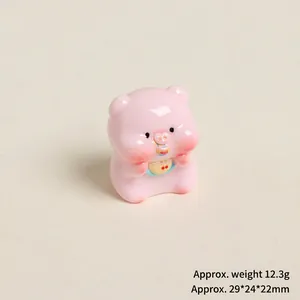 Close-up of pink resin pig figurine with dimensions 29x24x22mm and weight 12.3g