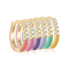 Detailed macro view of colorful enamel earrings with sparkling cubic zirconia on gold base