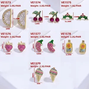 Colorful rhinestone fruit earrings collection including cherry and strawberry studs