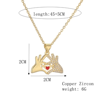 Detail view of gold MOM heart pendant with dimensions, material info, and 45cm chain length