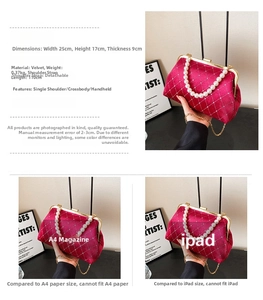 Detail view of fuchsia velvet shell bag featuring pearl handle and golden chain strap