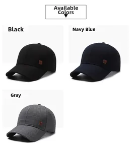 Close-up of three baseball caps in black, navy, and grey with side leather patch details