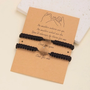 Detail of two woven spider web bracelets on display card with emotional English message