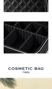 Detail of black quilted makeup case with adjustable dividers and sturdy handle for travel