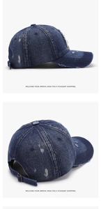 Detail view of navy denim baseball cap with vintage distressed texture and metal buckle