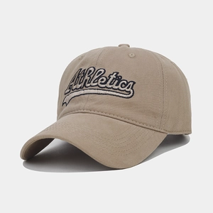 Close-up of khaki baseball cap featuring vintage Athletics letter embroidery and soft cotton fabric