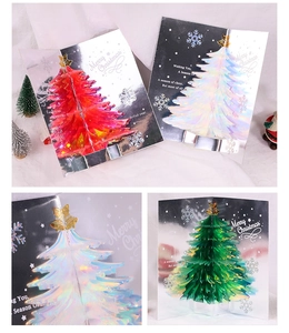 Detail showing 3D pop-up Christmas trees in red, white and green with glittery laser finish