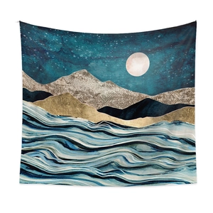 Detail of artistic tapestry with golden mountains, moon and waves in blue tones