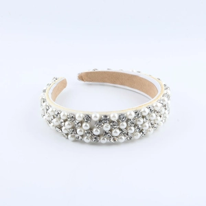 Detail of baroque headband featuring elegant white pearls and sparkling round rhinestones