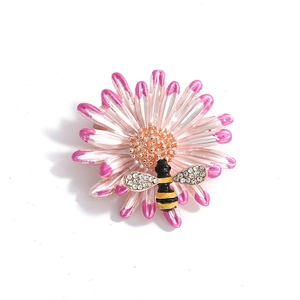 Pink and white gradient daisy flower brooch with a yellow bee and crystal accents