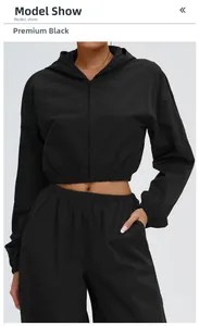 Close-up of premium black sun protection outdoor jacket with sleek zipper and hooded detail