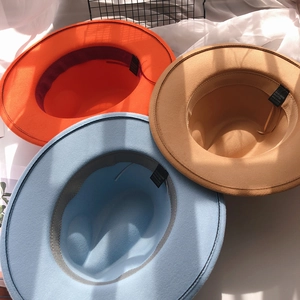 Detail view of the inner lining and fabric labels for polyester-cotton blend felt hats