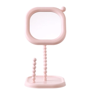 Elegant pink cream pearl desktop makeup mirror with rotatable square design.