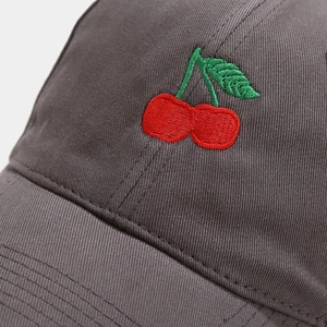 Grey cotton baseball cap with red cherry embroidery detail shown in front view