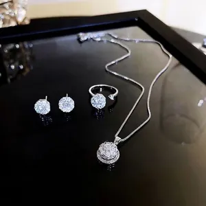 Sparkling silver jewelry set with crystal necklace, rotating ring and stud earrings