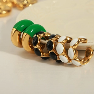 Punk style U-shaped gold plated titanium earrings with green black and white enamel detail