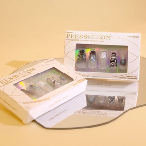 Chinese dragon relief press-on nails with black gradient and diamond accents in luxury packaging