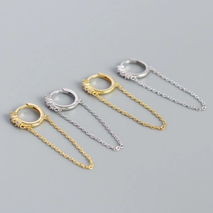 Detail of s925 silver geometric tassel chain earrings in gold and silver finish
