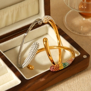 Three 18k gold plated stainless steel open bangles with pearls and colorful crystals