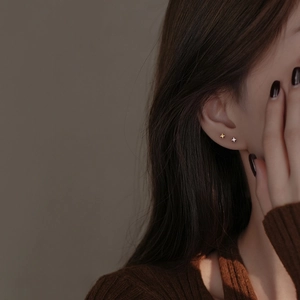 Minimalist S999 sterling silver four-pointed star stud earrings in gold and silver