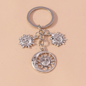 Creative silver sun and moon metal keychain with embossed face charms for bags and phones
