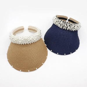 Stylish pearl embellished straw sun visor hat for women for summer sun protection.