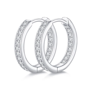 Pair of 925 sterling silver hoop earrings with pavé set moissanite stones on white background