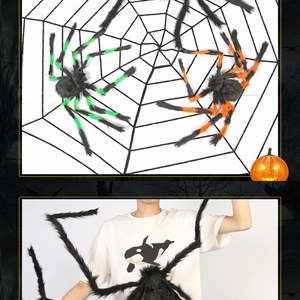 Detailed view of giant plush spiders in black, green and orange for Halloween party decor