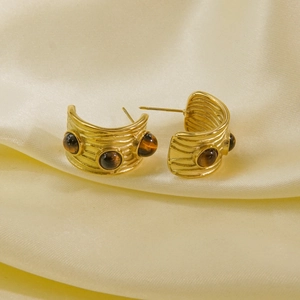 14K gold-plated C-shaped stainless steel earrings with tiger eye stones on silk background