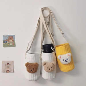 Quilted fabric water bottle bags with plush bear heads and adjustable canvas straps