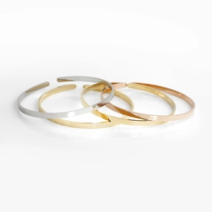 Polished stainless steel cuff bracelets in gold, silver and rose gold finishes