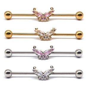 Detail of butterfly industrial barbell earrings with pink and white zircon in gold and silver